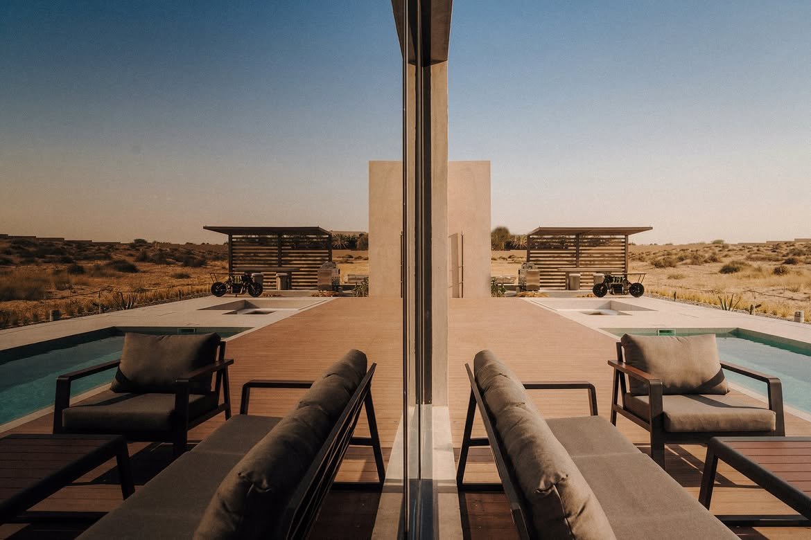 Looking out past a column to the loungers and the open desert