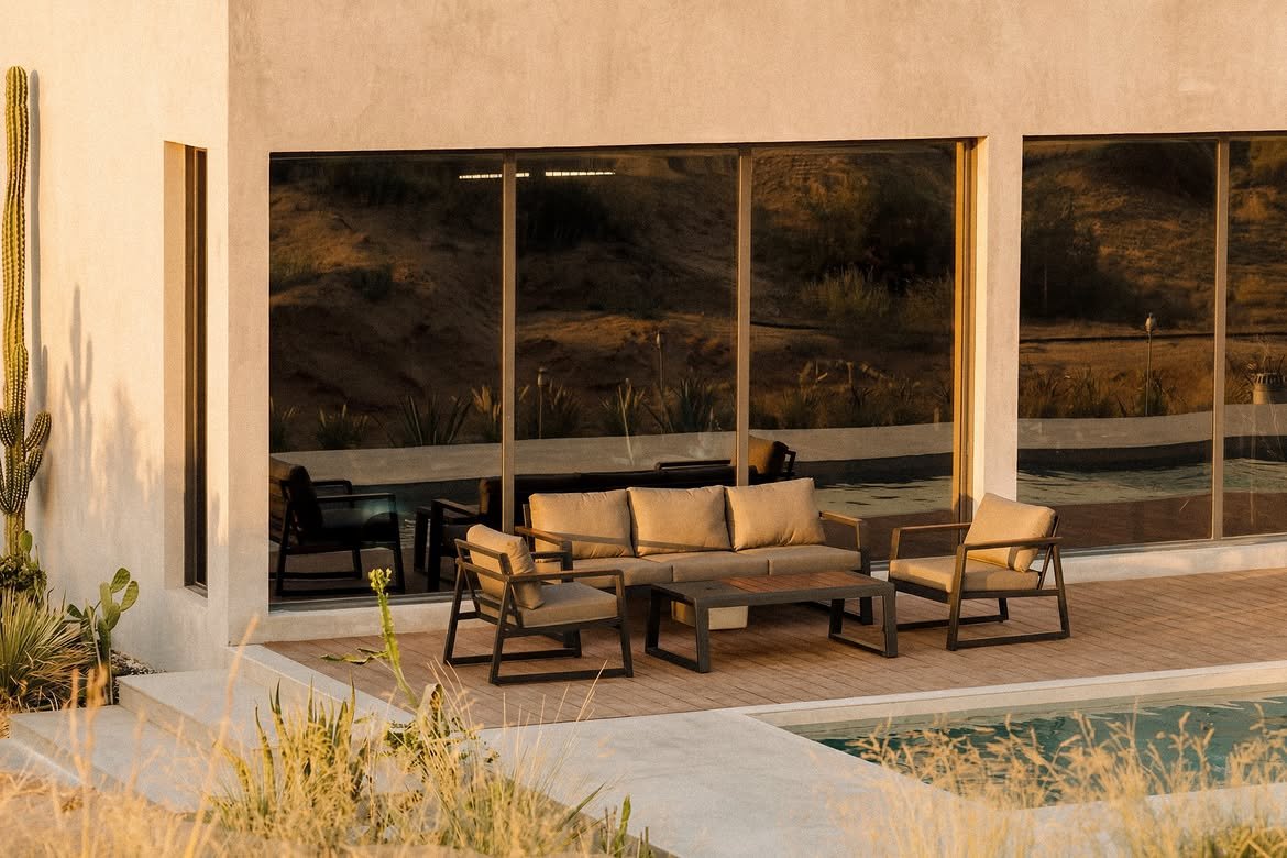 The poolside lounge seen through the glass, the pool in front